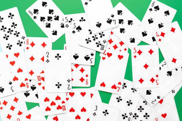 Deck of playing cards on green background in Barcelona, CT, Spain